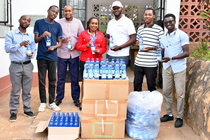 Machakos University team, Ms. Maureen Kaveke (centre), Mr. Brian Njogu (far left) with Kenya Red Cross Machakos, Mr. Vades Sangi, Procurement Officer (3rd right), and Machakos University students on attachment at the Organization